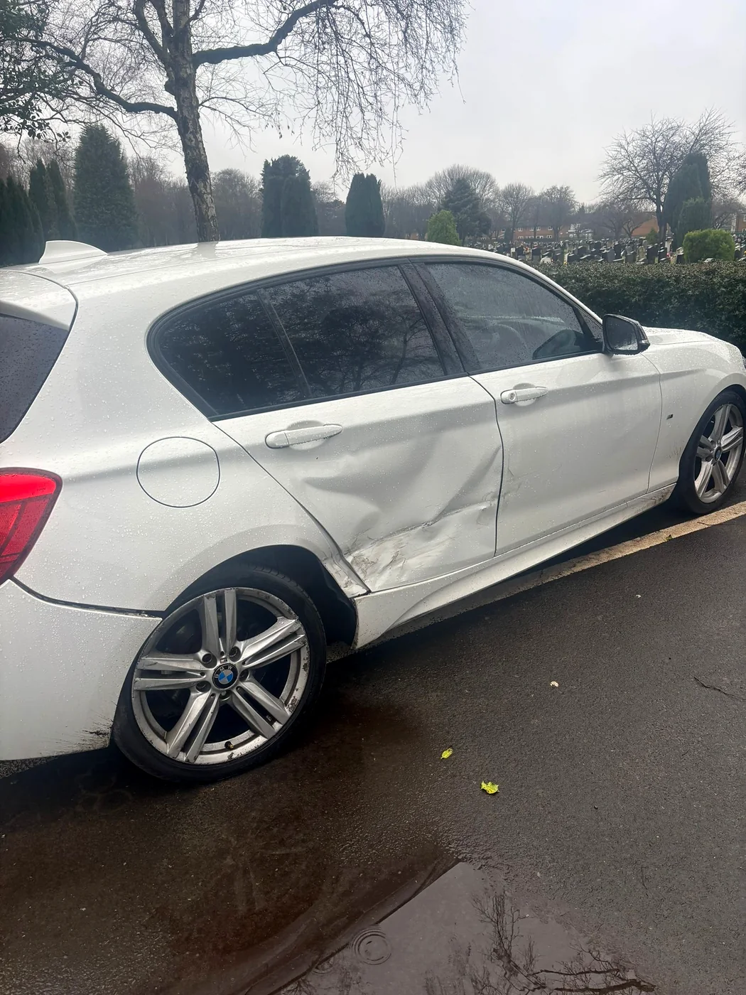 Silver BMW awaiting collection at the roadside