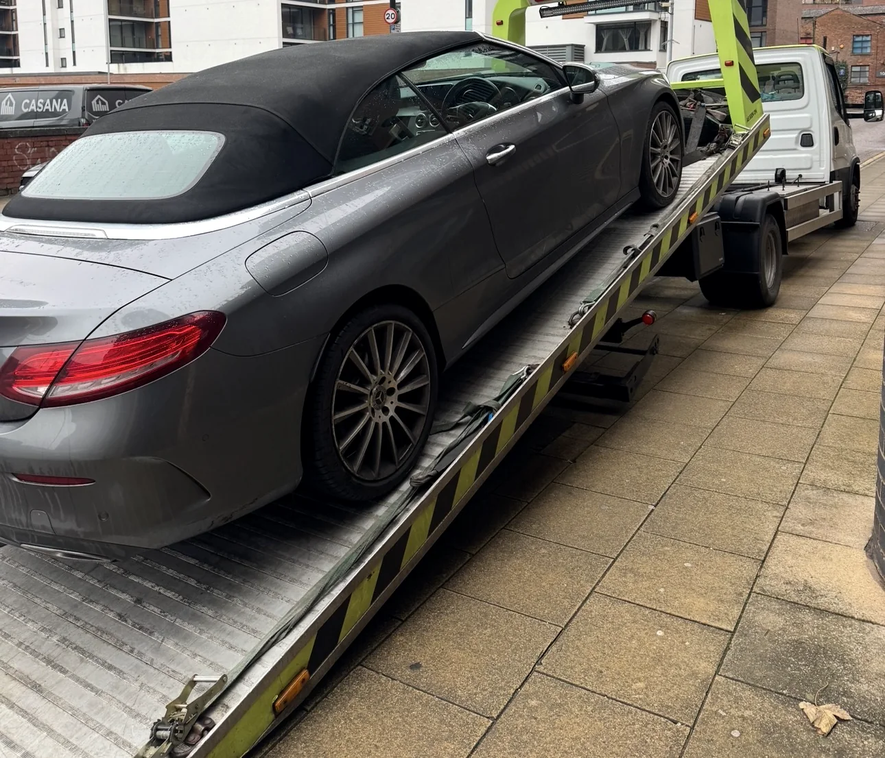 Grey Mercedes convertible secured on a recovery bed
