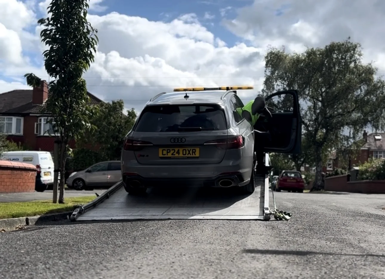 Vehicle positioned at a lowered recovery ramp