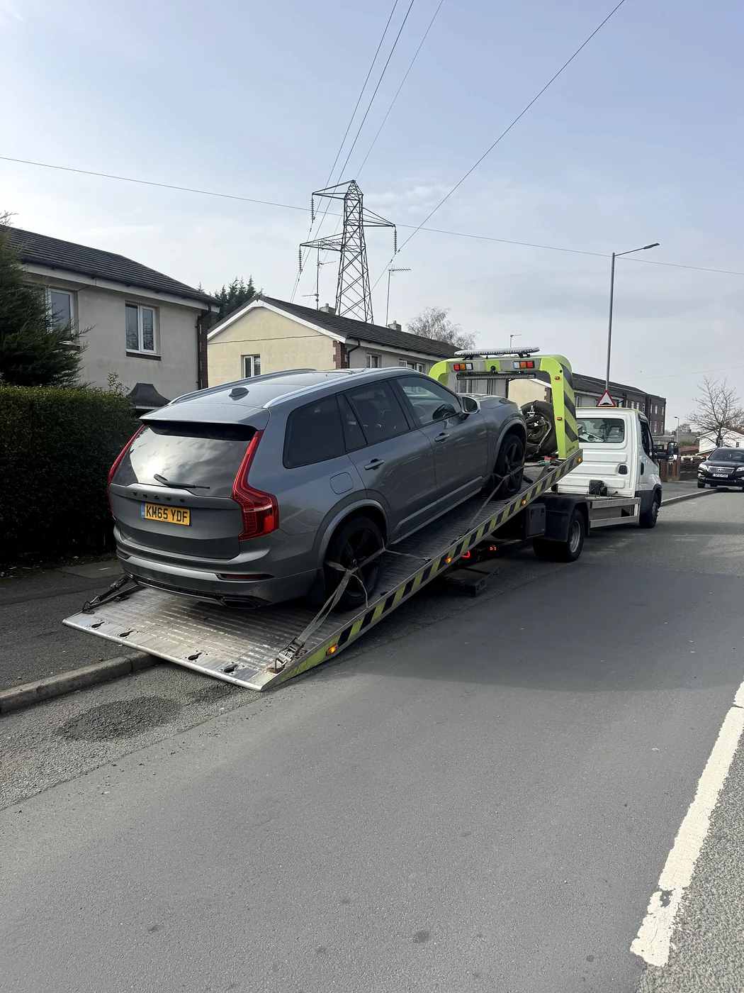 Grey Volvo positioned at a recovery ramp