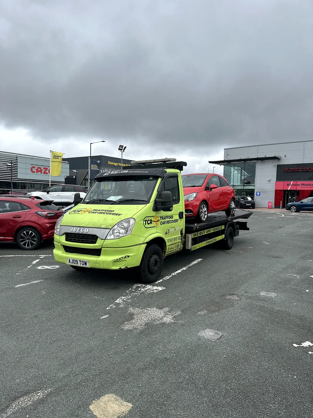 A red car collected from Arnold Clark in Stretford and delivered locally for a customer.