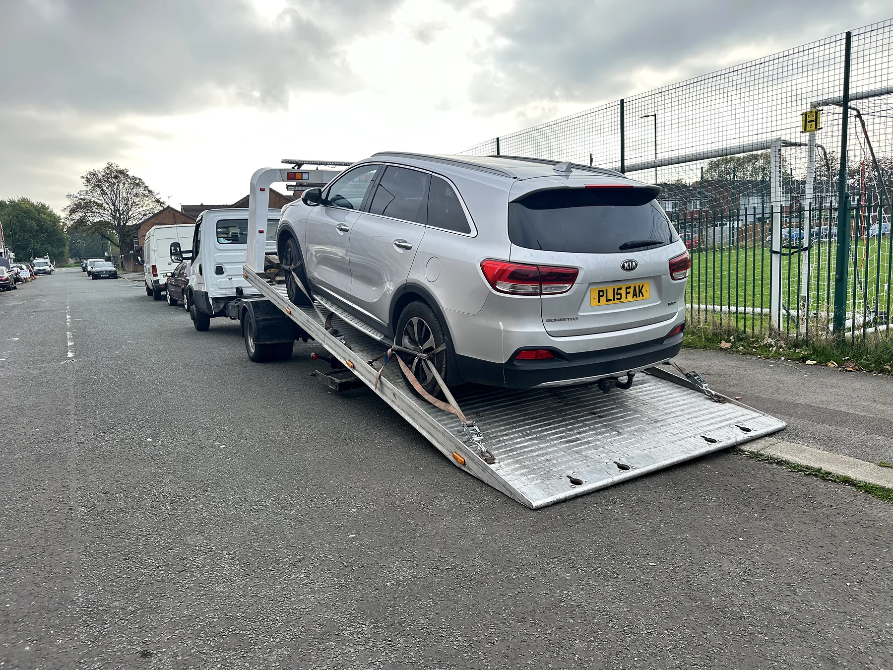 Recovery ramp and silver SUV during loading