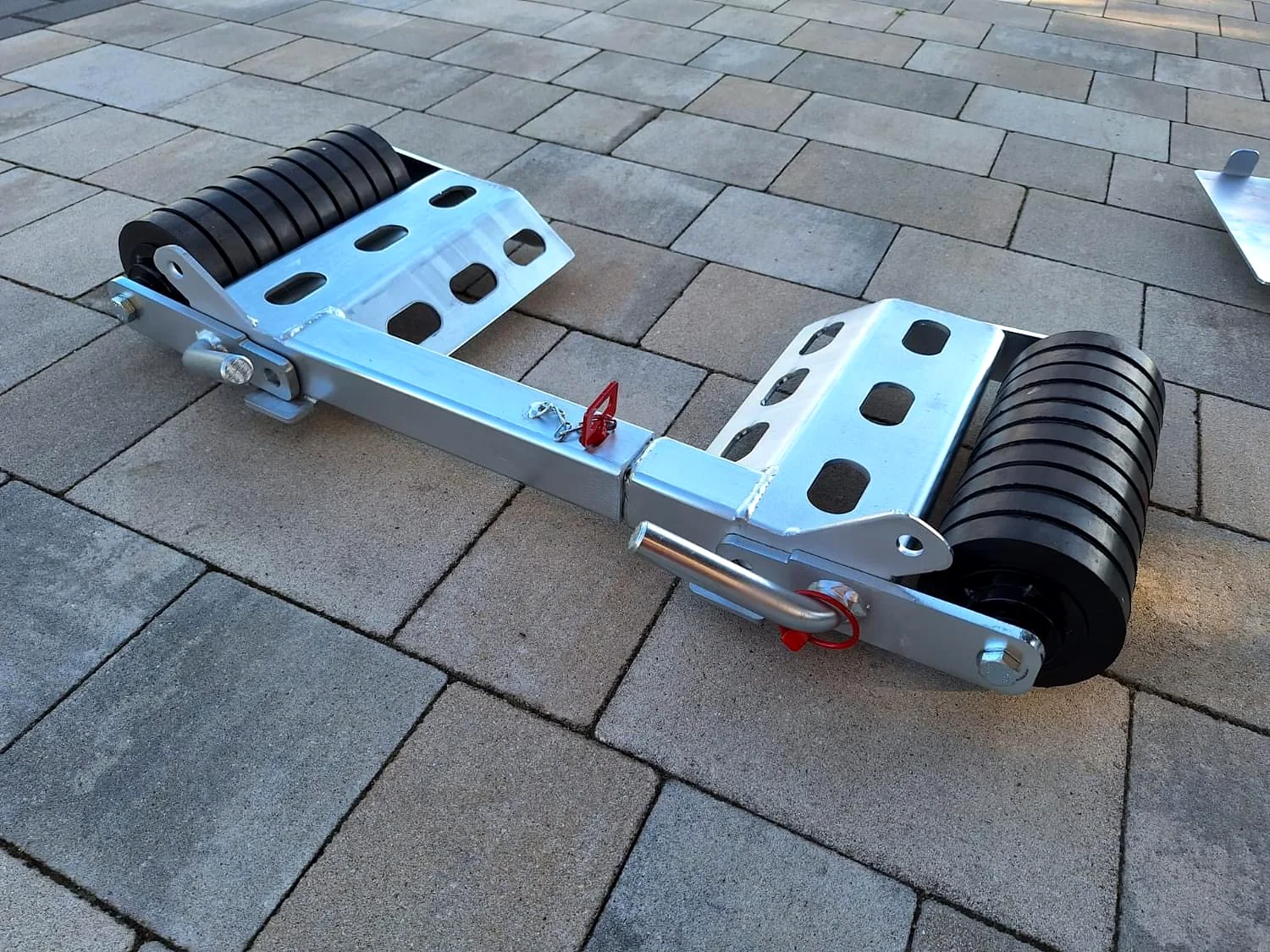Single recovery dolly showing its frame and rollers