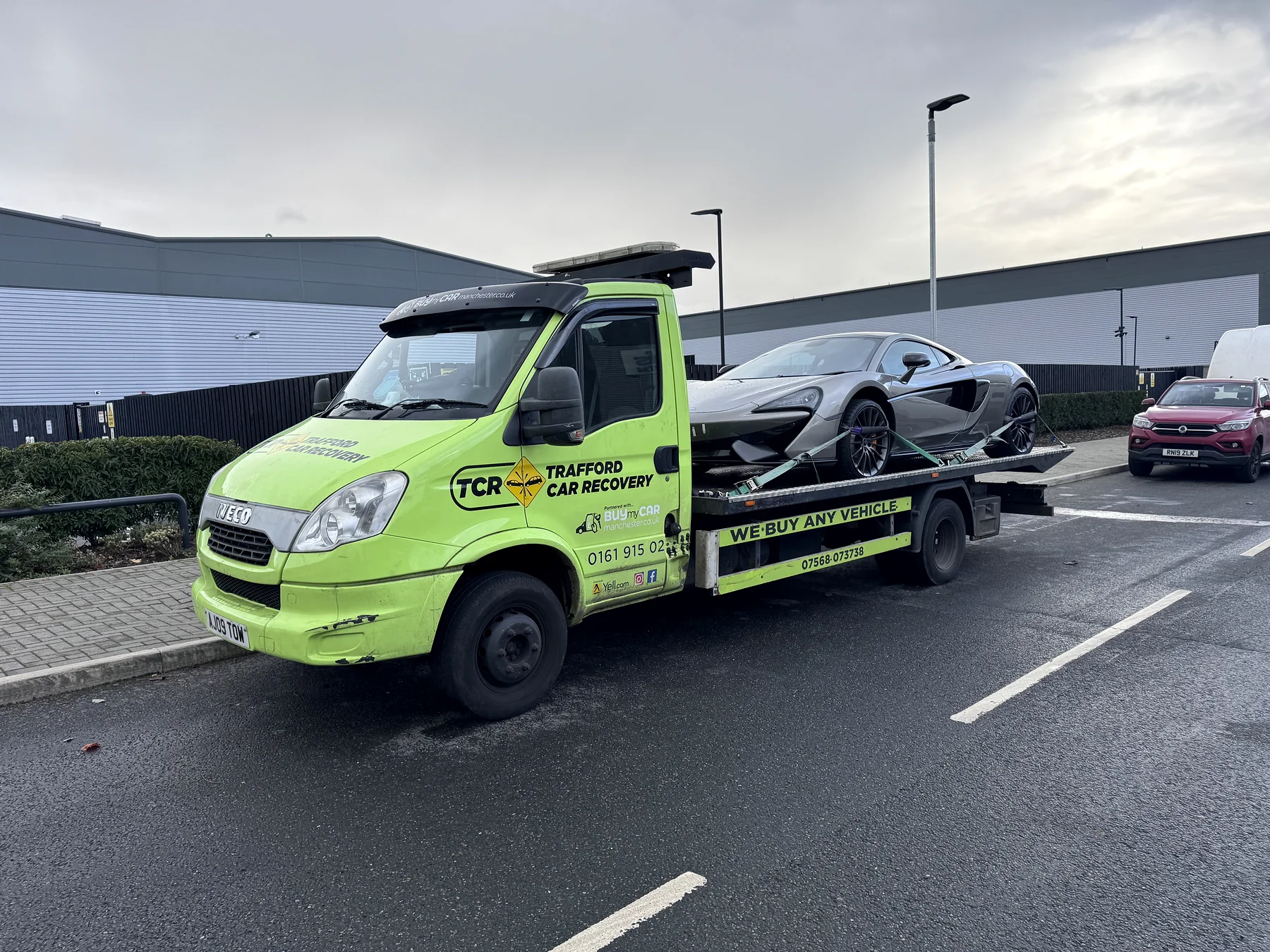 A closer view of the McLaren loaded for its transfer to the main dealer.