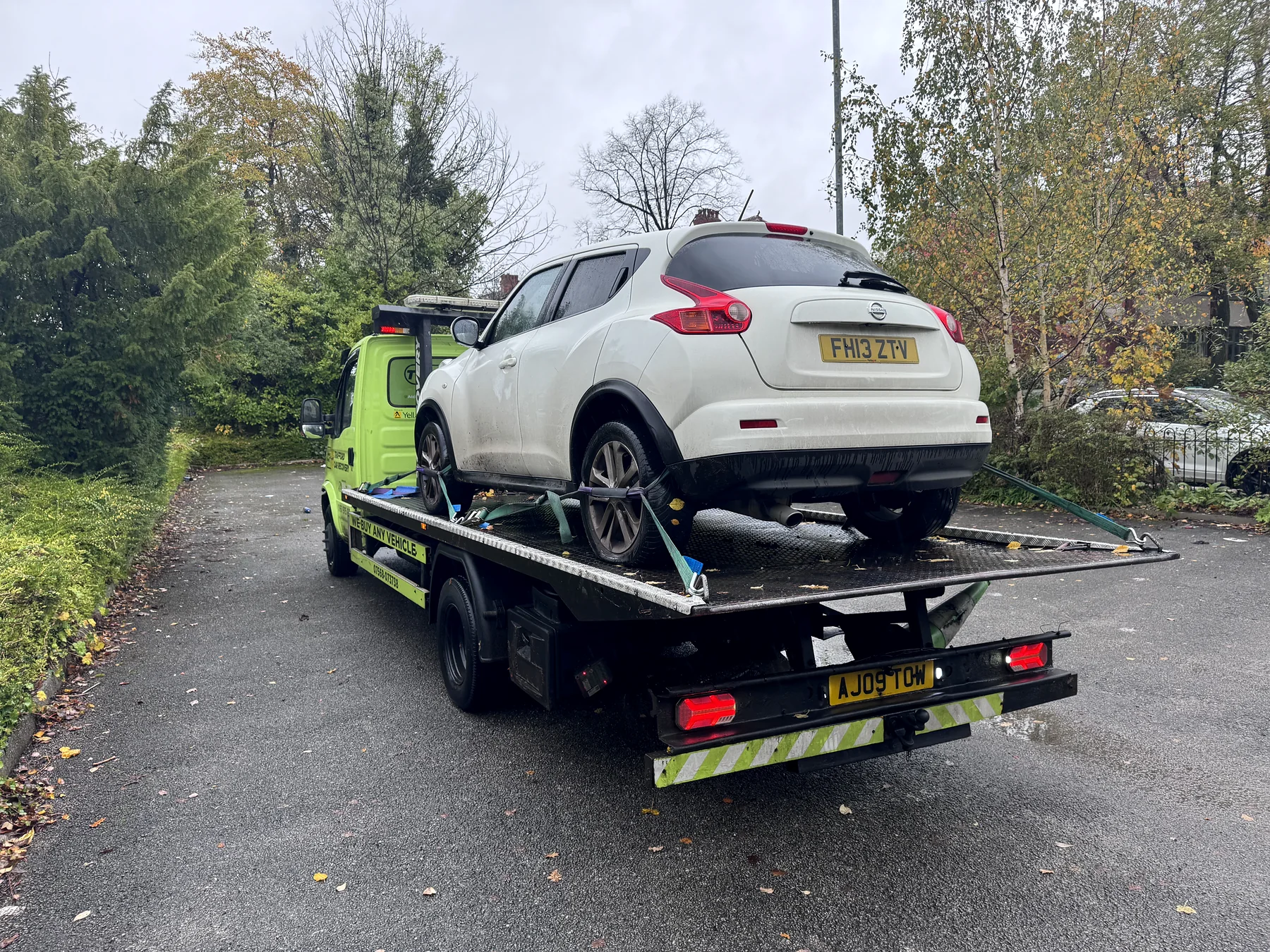 White Nissan SUV secured for transport