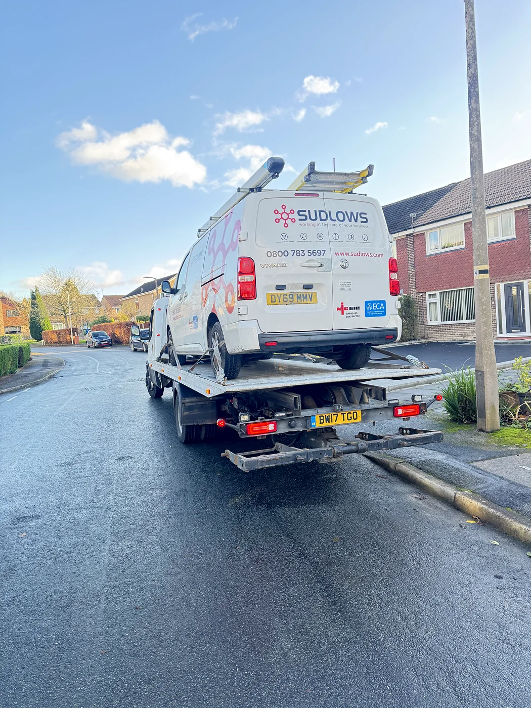 Commercial service van secured on the recovery bed