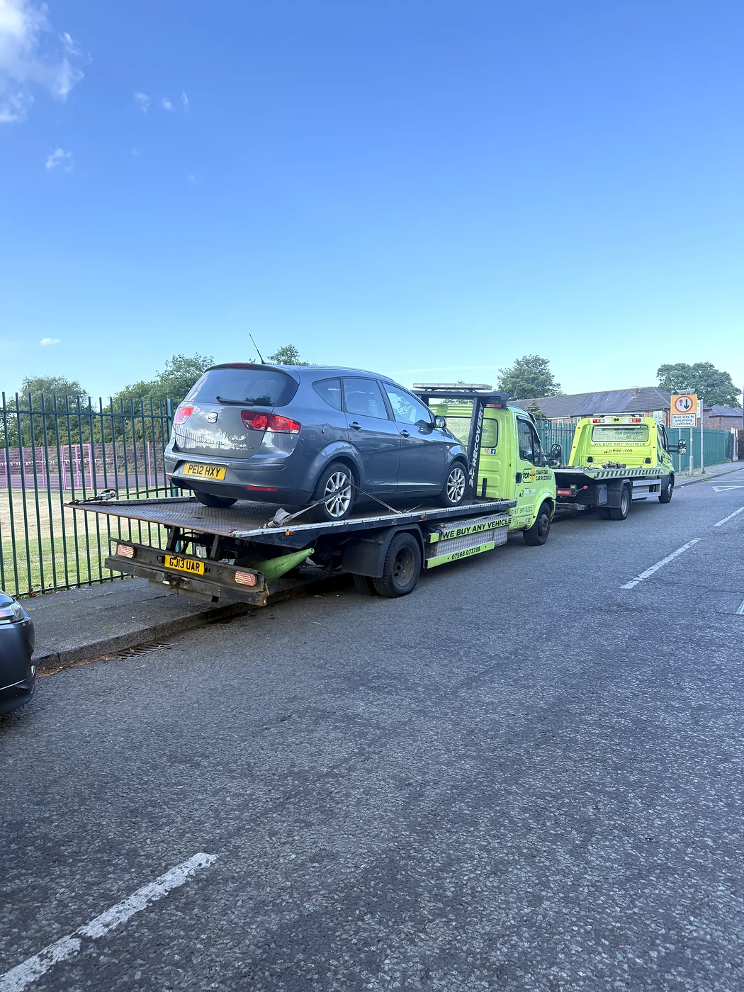 Loaded Trafford recovery truck beside another truck