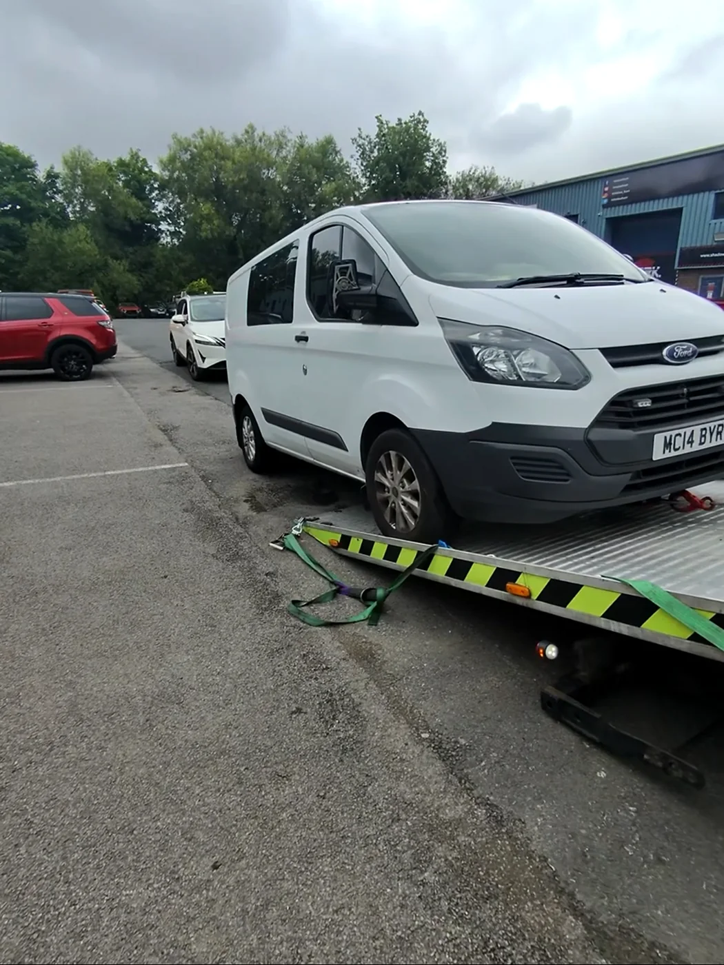 White Transit van at a recovery ramp