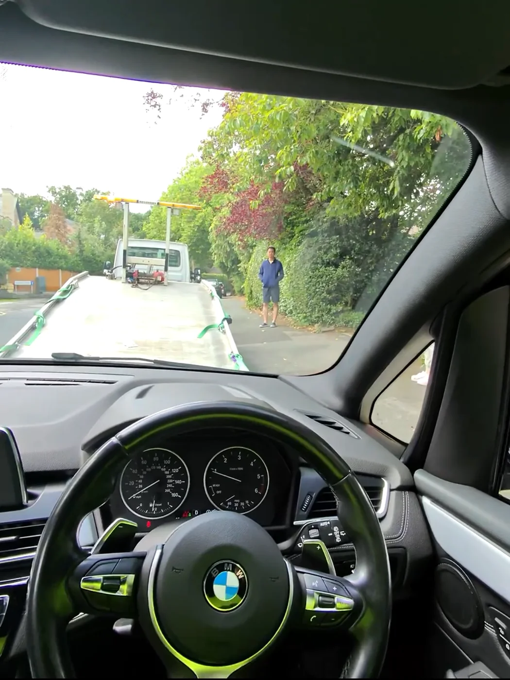 View through a car windscreen towards the recovery truck